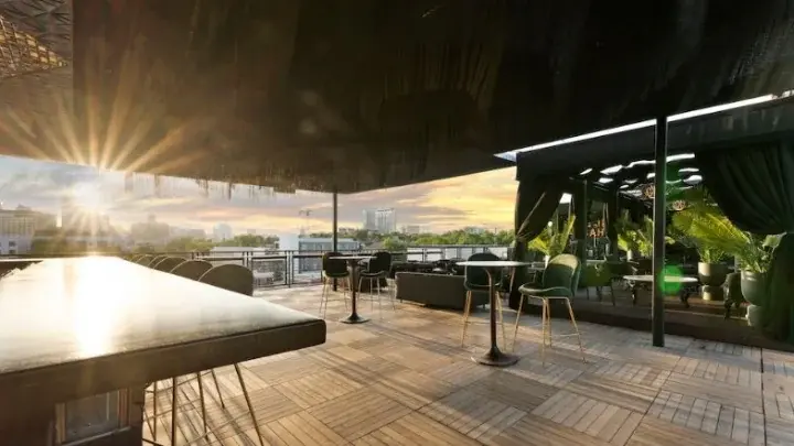 IYKYK Rooftop lounge overlooking the Austin skyline at sunset